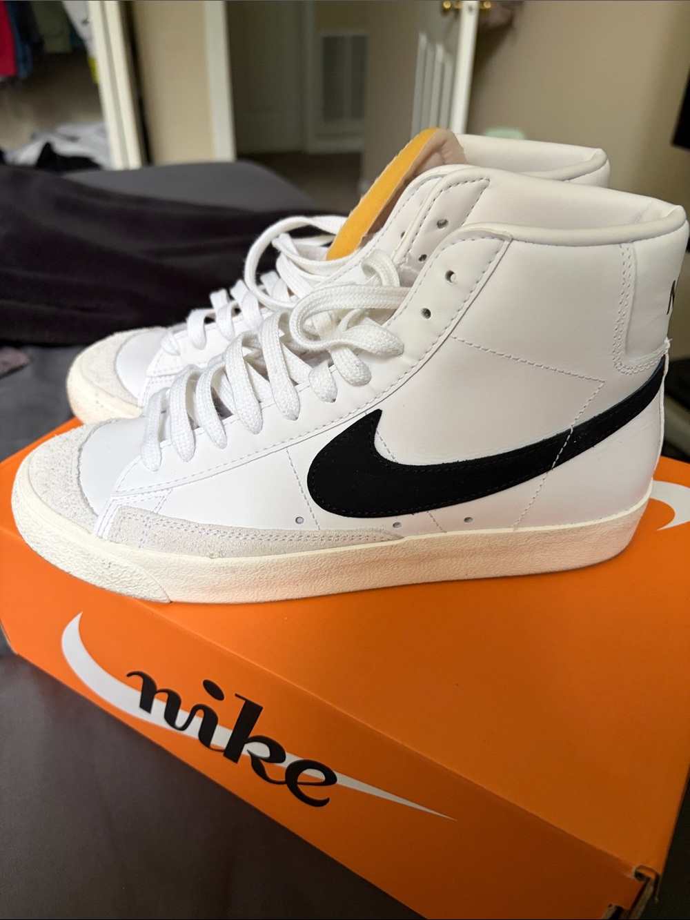 Nike blazer women’s White High-Top Sneakers with Black Swoosh
